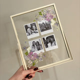 double-glass frame with pressed flowers arranged around four black-and-white photographs, creating a personalised floral keepsake.