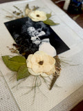 Held in Bloom pressed flower frame during the design process, with preserved wedding flowers arranged around a black-and-white photograph.