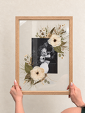 Oak Held in Bloom pressed flower frame held in two hands with a black-and-white wedding photo and preserved white bridal bouquet flowers.